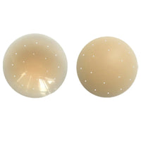Two beige circular products with small holes on a white background