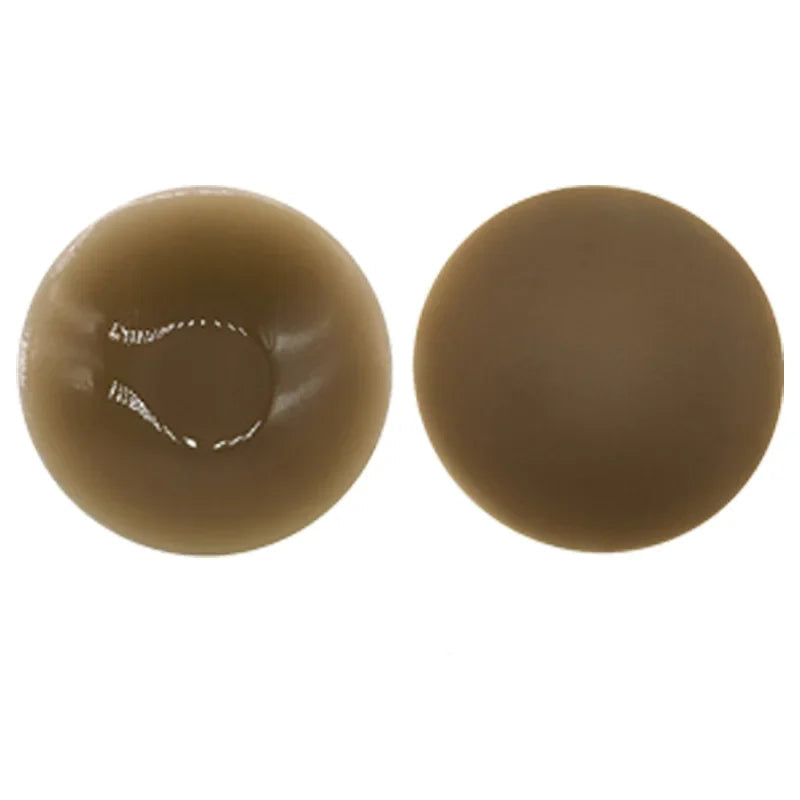 Two brown spherical objects on a white background
