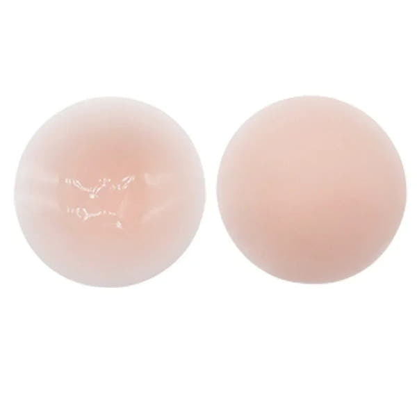Two light pink silicone pads on a white background